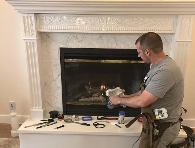 Westwood Chimney Sweep performing fireplace maintenance in Westwood, MA