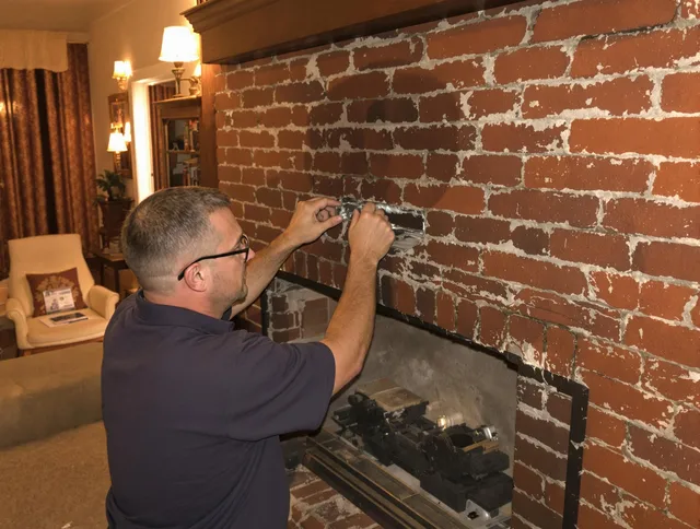 Westwood Chimney Sweep expert fixing a fireplace in Westwood, MA
